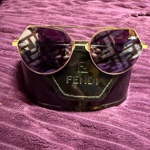 Fendi Aviator Women's Sunglasses with Gold Frame and black Lenses.
